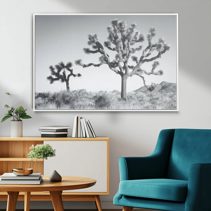 Black and white Joshua tree in a desert landscape with soft light and dry brush, perfect for rustic or minimalist home decor.