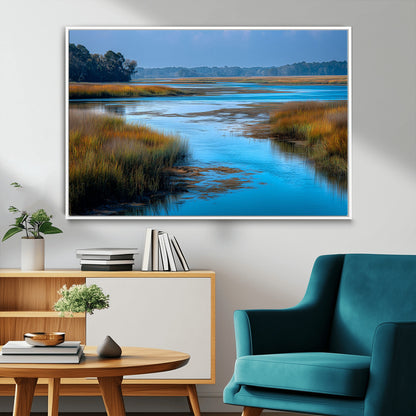 A peaceful marshland scene with calm blue water reflecting the surrounding grasses and trees, capturing the beauty of nature in a serene landscape.