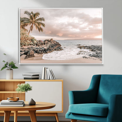 A peaceful beach scene with a palm tree and rocks, soft waves washing onto the shore under a soft pastel sky at sunset.