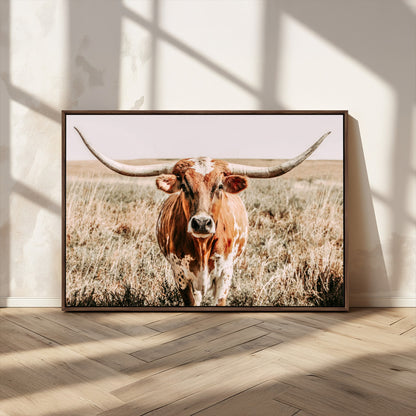 Framed longhorn cow canvas wall art with rustic prairie background, western animal print perfect for farmhouse or ranch style decor