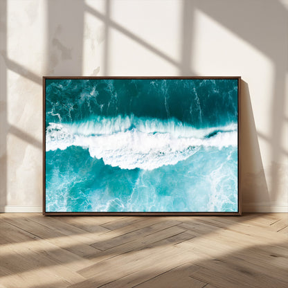 Aerial view of turquoise ocean waves crashing with white foam, perfect for tropical coastal or modern beach-style home decor.