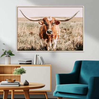 Framed longhorn cow canvas wall art with rustic prairie background, western animal print perfect for farmhouse or ranch style decor
