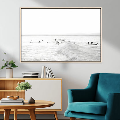 Monochrome photo of surfers riding and waiting on ocean waves, ideal for surf-themed or coastal energy wall decor.