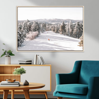 Bright ski trail lined with snow-covered pines and a skier in orange, perfect for alpine adventure or winter sports-inspired decor.