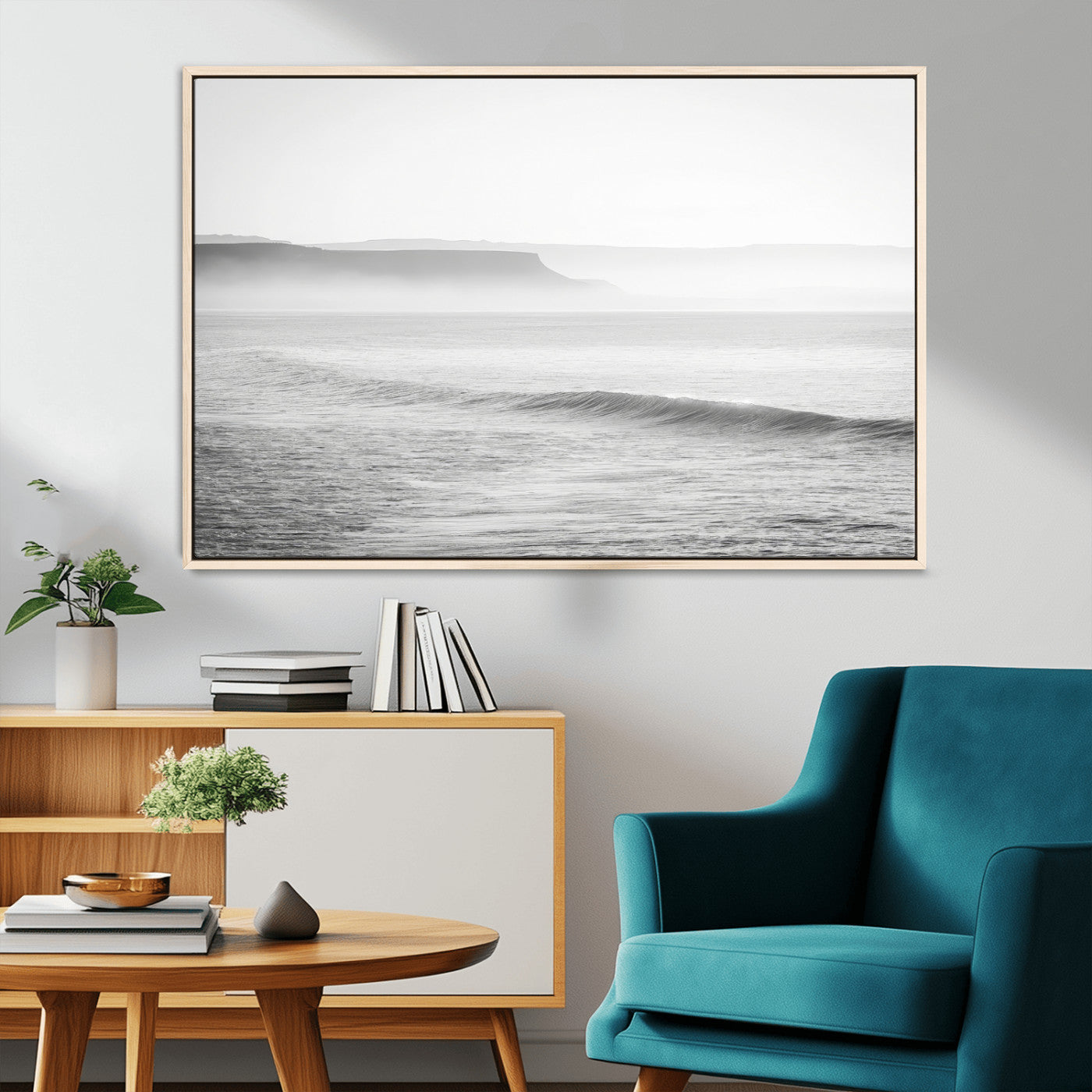 A black and white minimalist seascape featuring soft rolling waves and misty distant cliffs, creating a serene and timeless coastal atmosphere.