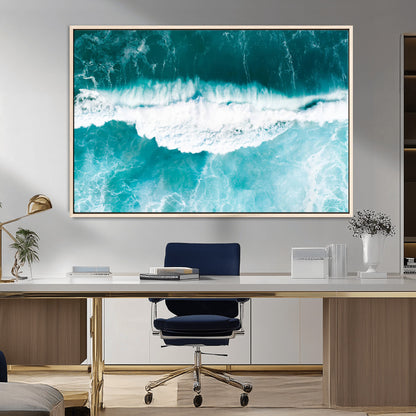 Aerial view of turquoise ocean waves crashing with white foam, perfect for tropical coastal or modern beach-style home decor.