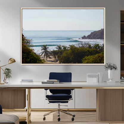 View of calm ocean waves with palm trees and a tropical coastline, ideal for coastal boho or beach-themed wall decor.