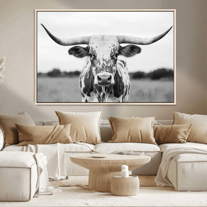 Capture the strength and elegance of nature with this striking black and white portrait of a longhorn cow. Its powerful presence makes a bold statement in any room.