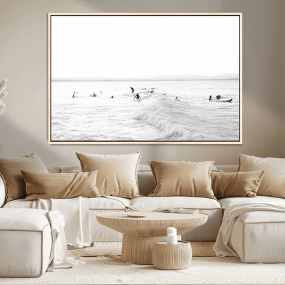 Monochrome photo of surfers riding and waiting on ocean waves, ideal for surf-themed or coastal energy wall decor.