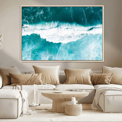 Aerial view of turquoise ocean waves crashing with white foam, perfect for tropical coastal or modern beach-style home decor.