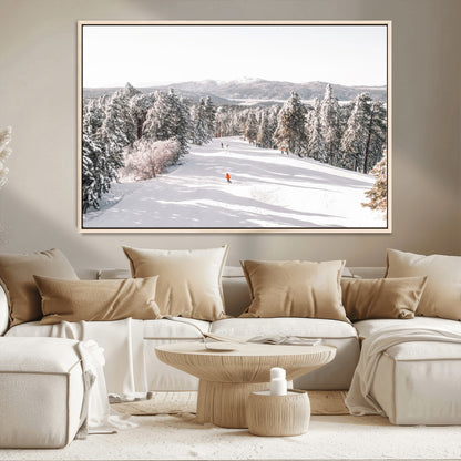 Bright ski trail lined with snow-covered pines and a skier in orange, perfect for alpine adventure or winter sports-inspired decor.