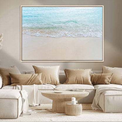 Soft shoreline with gentle aqua waves on smooth sand, ideal for minimalist coastal or pastel ocean-inspired home wall decor.