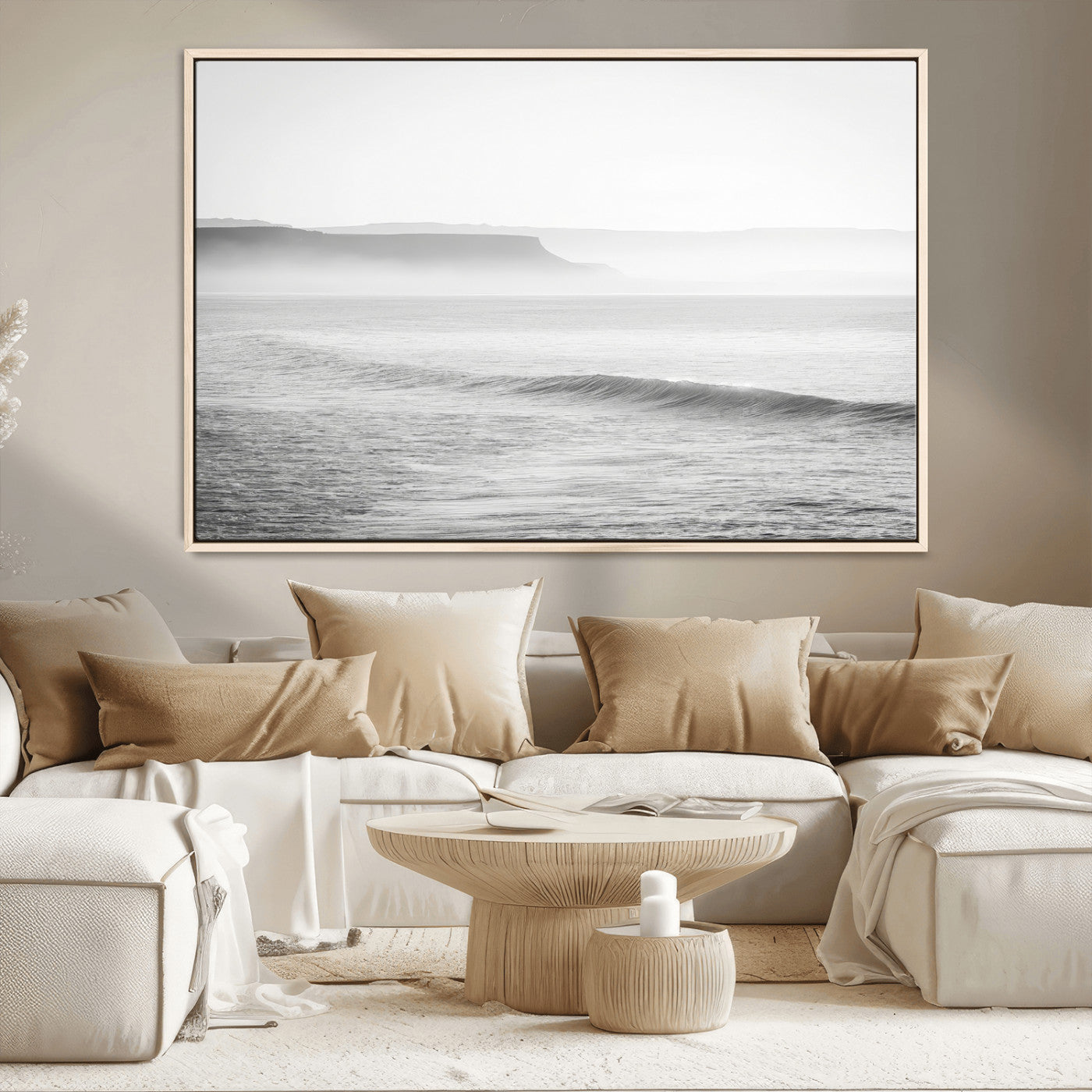 A black and white minimalist seascape featuring soft rolling waves and misty distant cliffs, creating a serene and timeless coastal atmosphere.