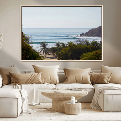 View of calm ocean waves with palm trees and a tropical coastline, ideal for coastal boho or beach-themed wall decor.