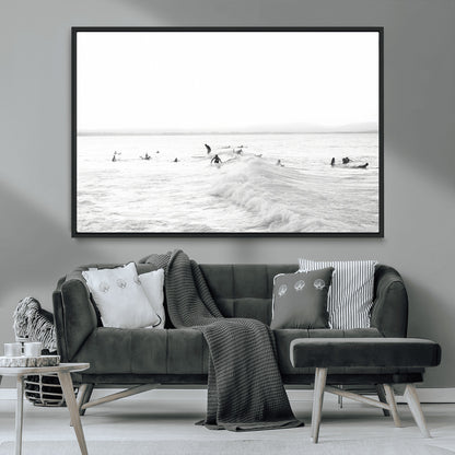 Monochrome photo of surfers riding and waiting on ocean waves, ideal for surf-themed or coastal energy wall decor.