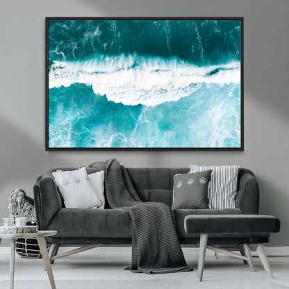 Aerial view of turquoise ocean waves crashing with white foam, perfect for tropical coastal or modern beach-style home decor.