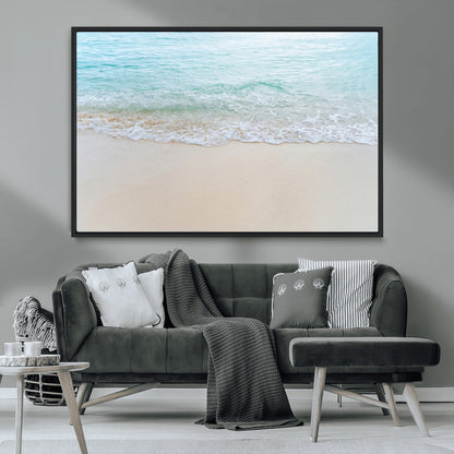 Soft shoreline with gentle aqua waves on smooth sand, ideal for minimalist coastal or pastel ocean-inspired home wall decor.