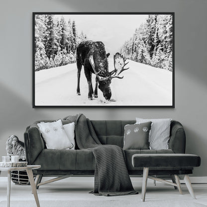 A majestic moose grazing in the snow-covered wilderness, surrounded by snow-covered trees, creating a peaceful winter scene.
