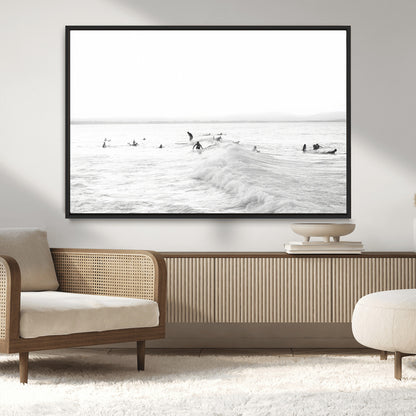 Monochrome photo of surfers riding and waiting on ocean waves, ideal for surf-themed or coastal energy wall decor.