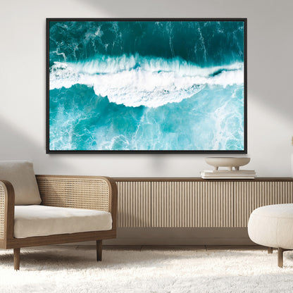 Aerial view of turquoise ocean waves crashing with white foam, perfect for tropical coastal or modern beach-style home decor.