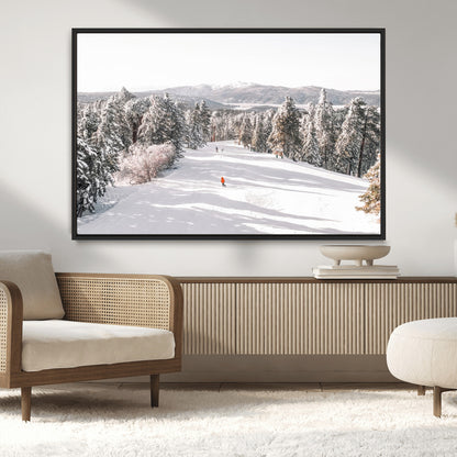 Bright ski trail lined with snow-covered pines and a skier in orange, perfect for alpine adventure or winter sports-inspired decor.