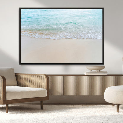 Soft shoreline with gentle aqua waves on smooth sand, ideal for minimalist coastal or pastel ocean-inspired home wall decor.
