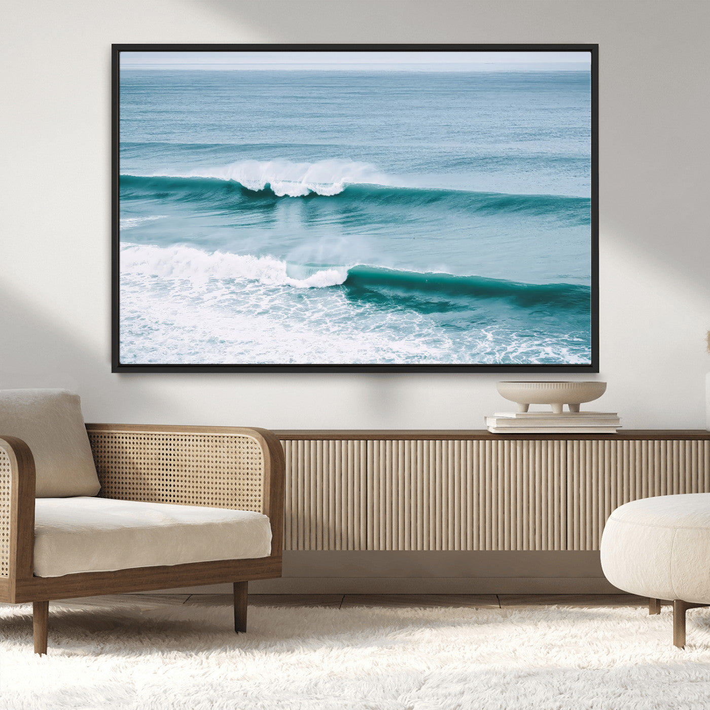 Powerful ocean waves rolling towards the shore, their turquoise hues blending with white sea foam under an open horizon, capturing the essence of the ocean's movement.