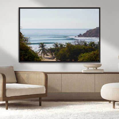 View of calm ocean waves with palm trees and a tropical coastline, ideal for coastal boho or beach-themed wall decor.