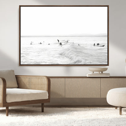 Monochrome photo of surfers riding and waiting on ocean waves, ideal for surf-themed or coastal energy wall decor.