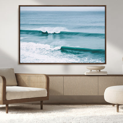 Powerful ocean waves rolling towards the shore, their turquoise hues blending with white sea foam under an open horizon, capturing the essence of the ocean's movement.