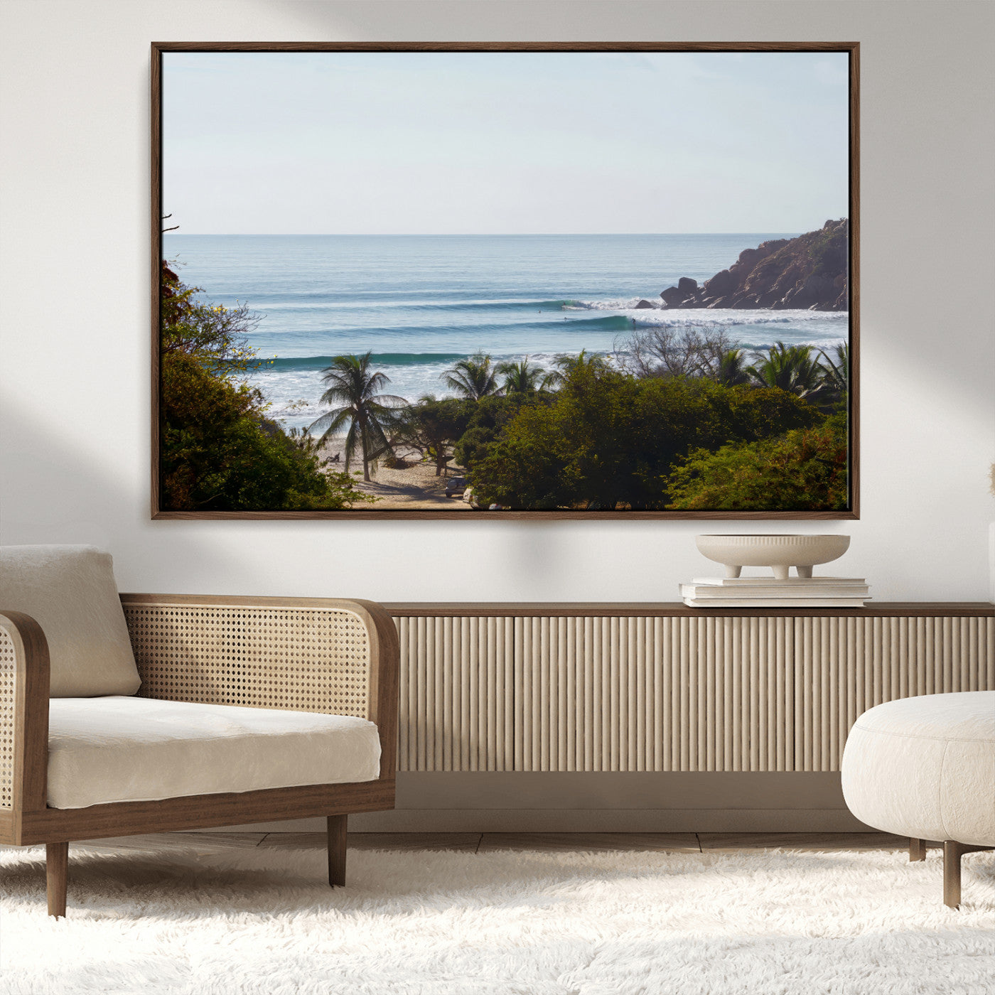 View of calm ocean waves with palm trees and a tropical coastline, ideal for coastal boho or beach-themed wall decor.