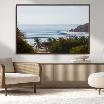 View of calm ocean waves with palm trees and a tropical coastline, ideal for coastal boho or beach-themed wall decor.
