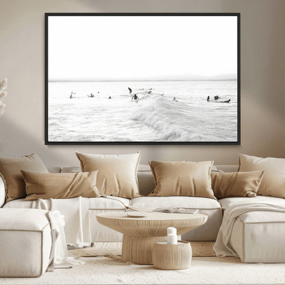 Monochrome photo of surfers riding and waiting on ocean waves, ideal for surf-themed or coastal energy wall decor.