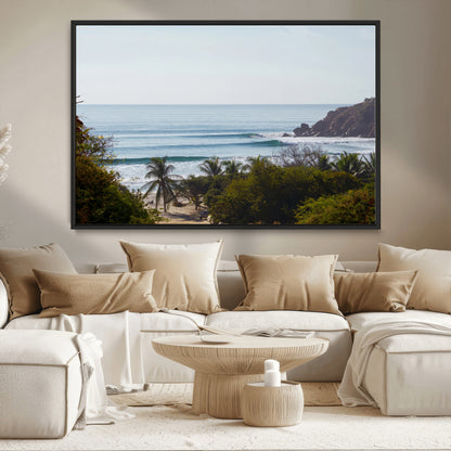 View of calm ocean waves with palm trees and a tropical coastline, ideal for coastal boho or beach-themed wall decor.