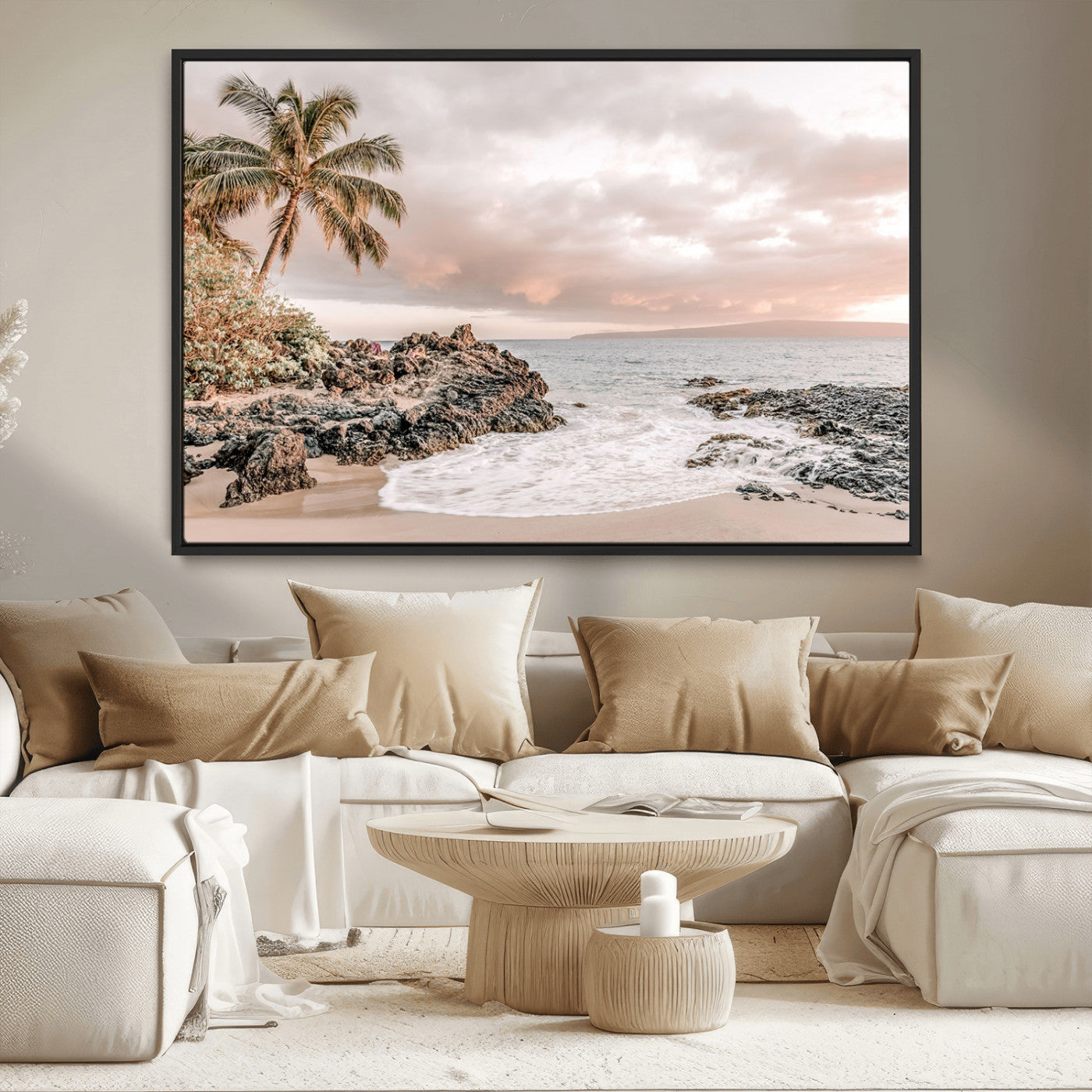 A peaceful beach scene with a palm tree and rocks, soft waves washing onto the shore under a soft pastel sky at sunset.