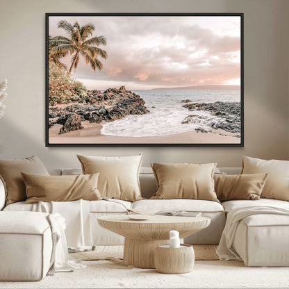 A peaceful beach scene with a palm tree and rocks, soft waves washing onto the shore under a soft pastel sky at sunset.