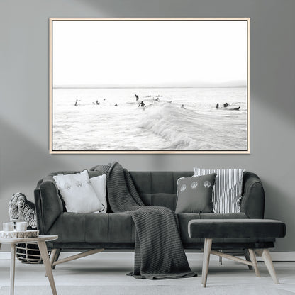 Monochrome photo of surfers riding and waiting on ocean waves, ideal for surf-themed or coastal energy wall decor.