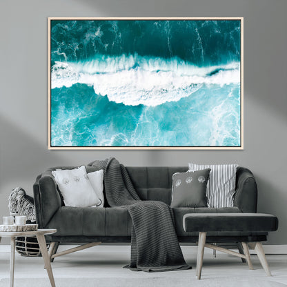 Aerial view of turquoise ocean waves crashing with white foam, perfect for tropical coastal or modern beach-style home decor.