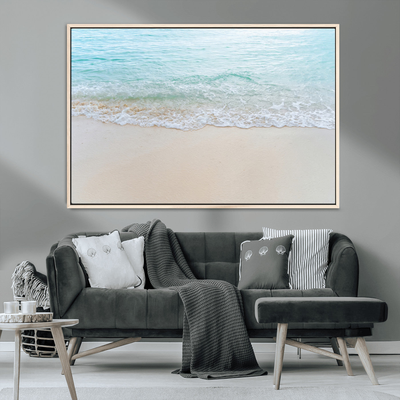 Soft shoreline with gentle aqua waves on smooth sand, ideal for minimalist coastal or pastel ocean-inspired home wall decor.