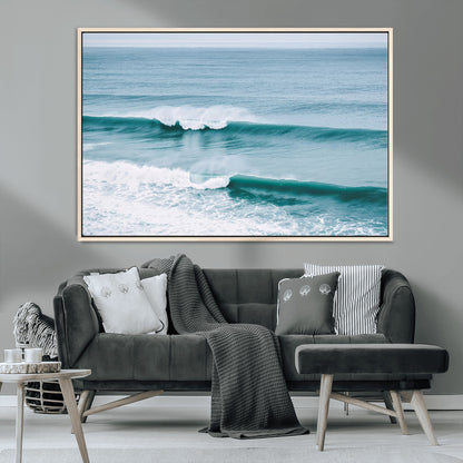 Powerful ocean waves rolling towards the shore, their turquoise hues blending with white sea foam under an open horizon, capturing the essence of the ocean's movement.