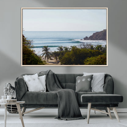 View of calm ocean waves with palm trees and a tropical coastline, ideal for coastal boho or beach-themed wall decor.