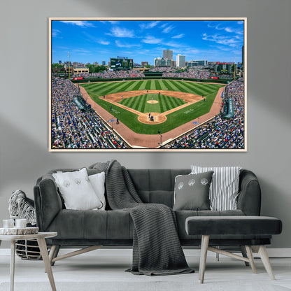 A wide-angle shot of a baseball field filled with spectators, with players on the field and the iconic Wrigley Field scoreboard in the background.
