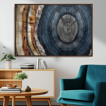 A stunning close-up of a tree trunk showing the intricate, circular growth rings, showcasing the natural textures and rich contrasts in deep blues, browns, and silvers.