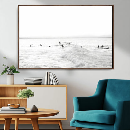 Monochrome photo of surfers riding and waiting on ocean waves, ideal for surf-themed or coastal energy wall decor.