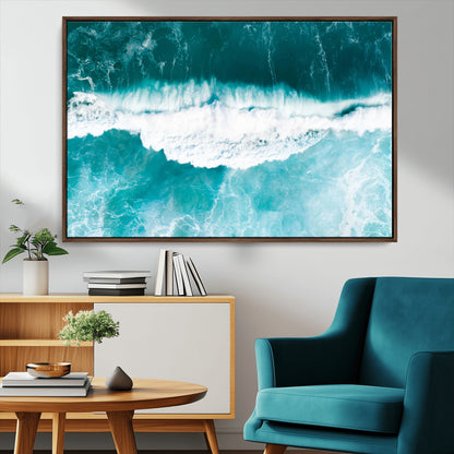 Aerial view of turquoise ocean waves crashing with white foam, perfect for tropical coastal or modern beach-style home decor.