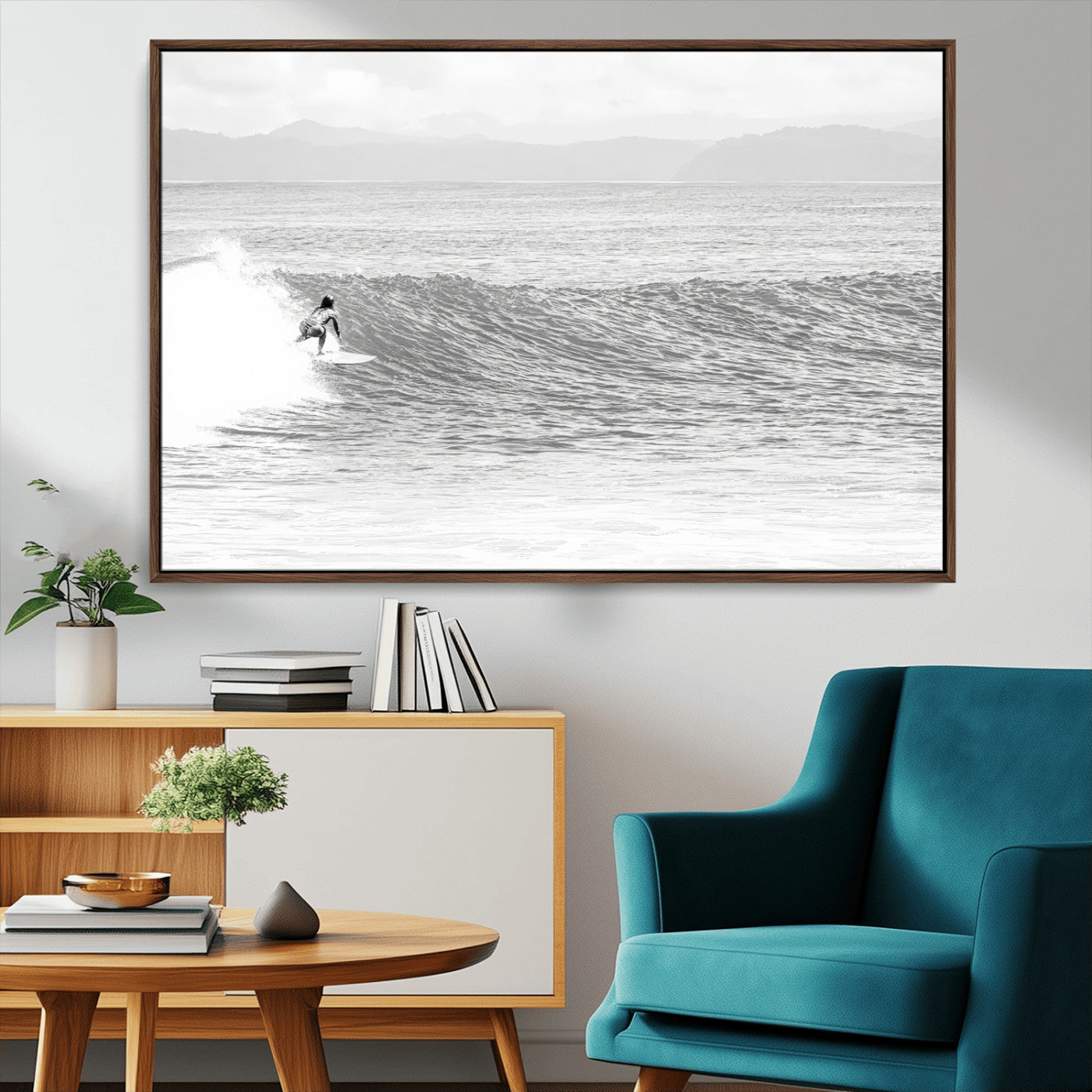 Monochrome photo of a surfer riding a wave with distant mountains, ideal for coastal motion or black and white surf-themed wall decor.