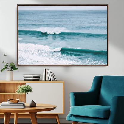 Powerful ocean waves rolling towards the shore, their turquoise hues blending with white sea foam under an open horizon, capturing the essence of the ocean's movement.