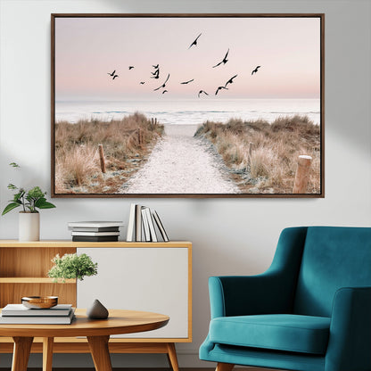 A peaceful coastal pathway leading to the ocean, with birds flying across a soft pastel sky, creating a calm and scenic beach atmosphere.