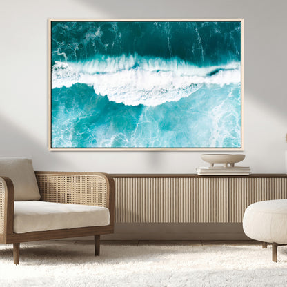 Aerial view of turquoise ocean waves crashing with white foam, perfect for tropical coastal or modern beach-style home decor.