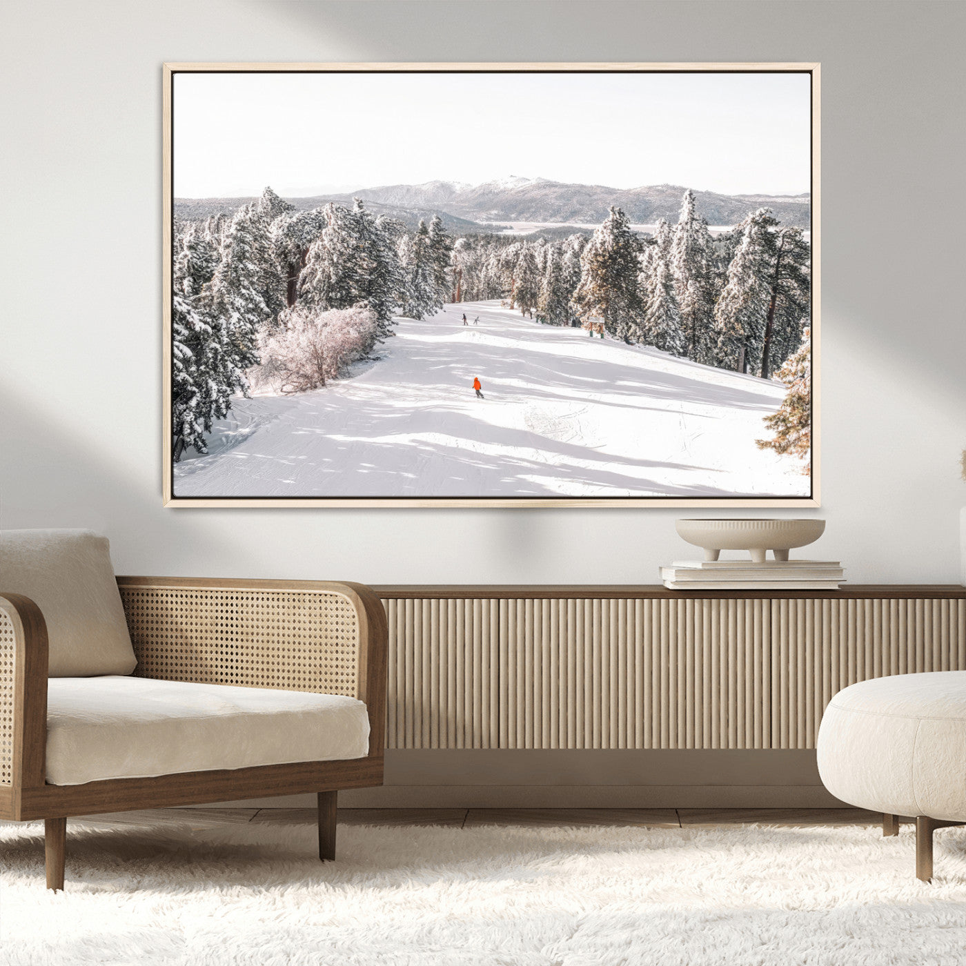 Bright ski trail lined with snow-covered pines and a skier in orange, perfect for alpine adventure or winter sports-inspired decor.